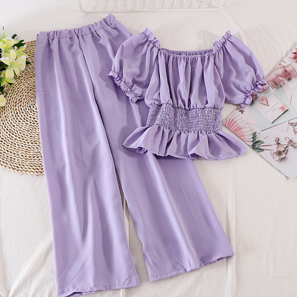 Modern női szett hosszú nadrágot és rövid ujjú blúzt tartalmaz