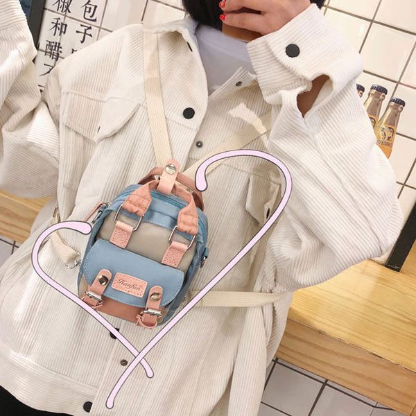 Mala ženska torba s kratkom i dugom ručkom