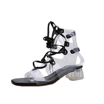 Sieviešu sandales ar krusteniskām saitēm un zemu papēdi