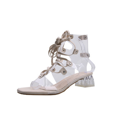 Sieviešu sandales ar krusteniskām saitēm un zemu papēdi