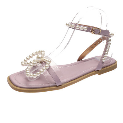 Női alkalmi szandál lapos talppal és gyöngyökkel