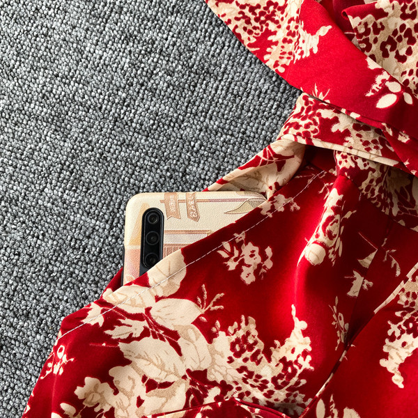 Moderns sieviešu garais kombinezons ar ziedu rakstu un jostasvietu