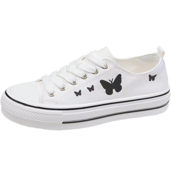 Alkalmi női tornacipő fűzővel és pillangó rátéttel