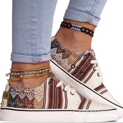 Uus mudel naiste värvilistest paelte ja lameda tallaga tossud