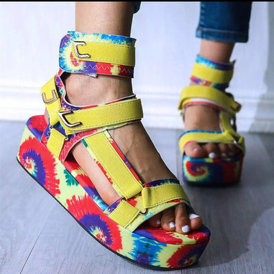 New model of women`s platform sandals with colored pattern and patches