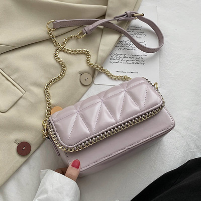 Sieviešu ādas soma ar garu metāla rokturi