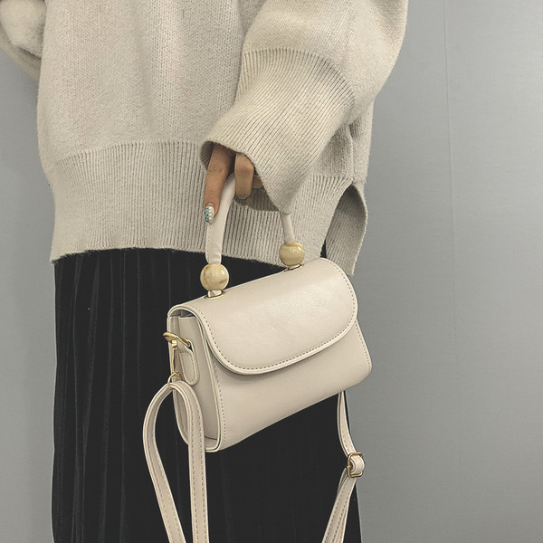 Moderna ženska torba sa kratkom i dugom ručkom od eko kože