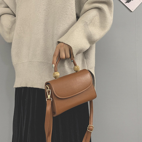 Moderna ženska torba sa kratkom i dugom ručkom od eko kože