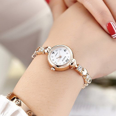 Kvarca sieviešu metāla rokassprādzes pulkstenis