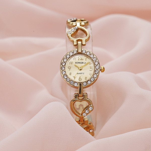 Arany női karóra kövekkel