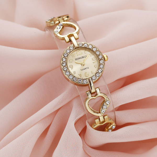 Arany női karóra kövekkel