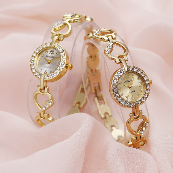 Arany női karóra kövekkel