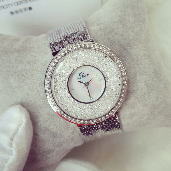 Metāla sieviešu pulkstenis ar akmeņiem