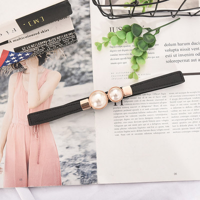 Moderna sieviešu plānā eko-ādas josta ar pērlēm