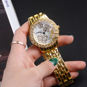 Fém női karóra pillangókkal