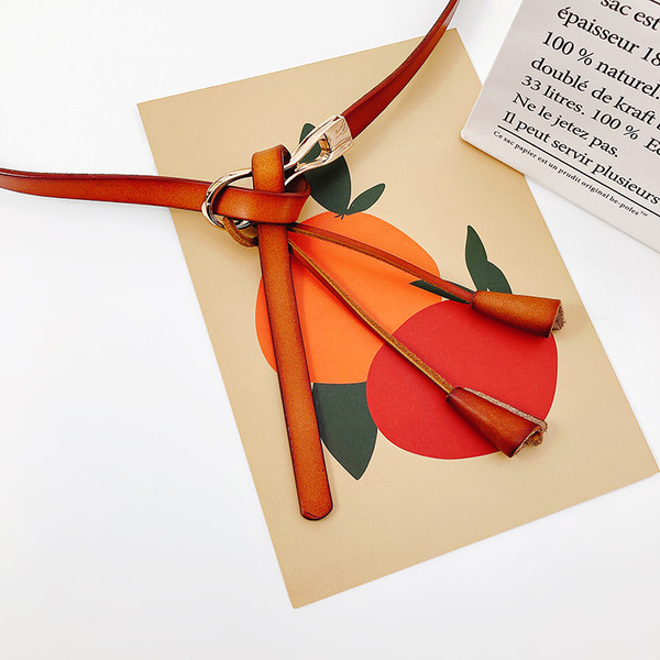 Sieviešu slaida josta ar mākslīgās ādas pušķi