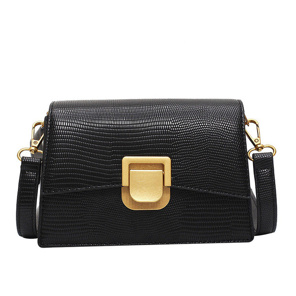 Moderna ženska kožna torba s metalnim kopčanjem i dugom ručkom