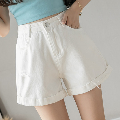 Női farmer szakadt motívumokkal