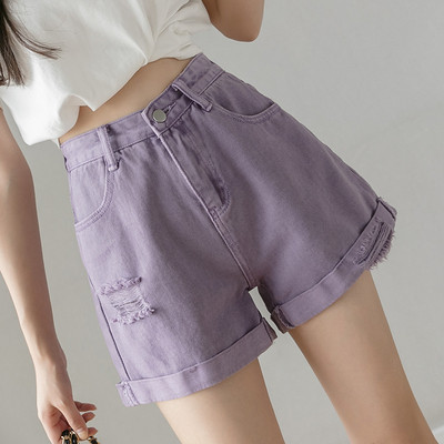 Női farmer szakadt motívumokkal