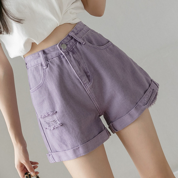 Női farmer szakadt motívumokkal