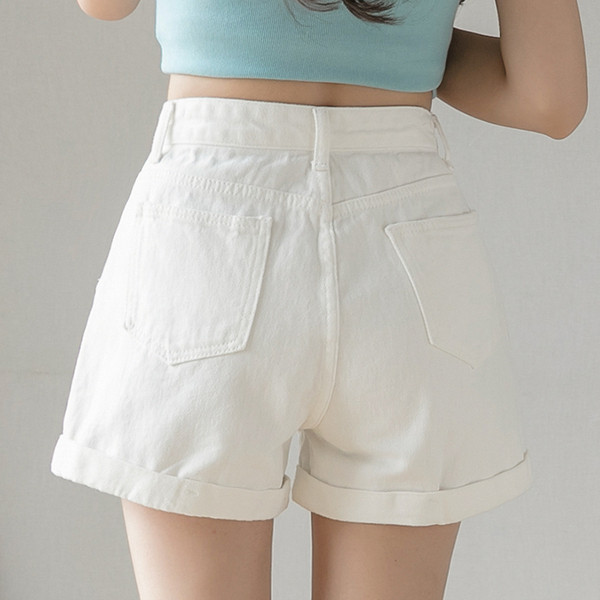 Női farmer szakadt motívumokkal