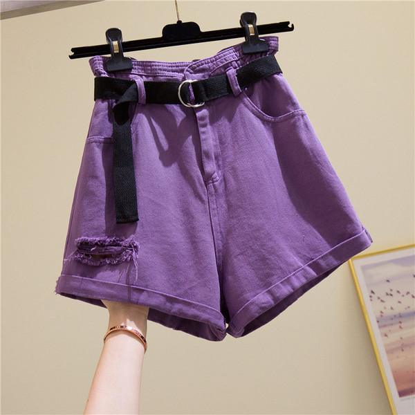 Női alkalmi farmer övvel és magas derékkal