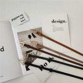 Vékony női bőr öv fém háromszöggel