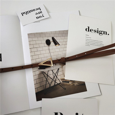 Vékony női bőr öv fém háromszöggel