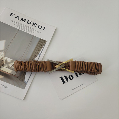 Elasztikus női öv fém háromszöggel