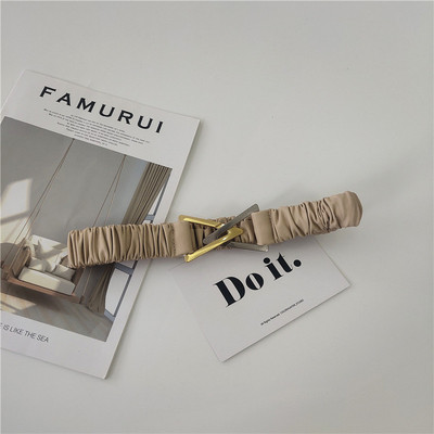 Elasztikus női öv fém háromszöggel