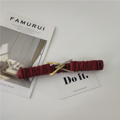 Elasztikus női öv fém háromszöggel