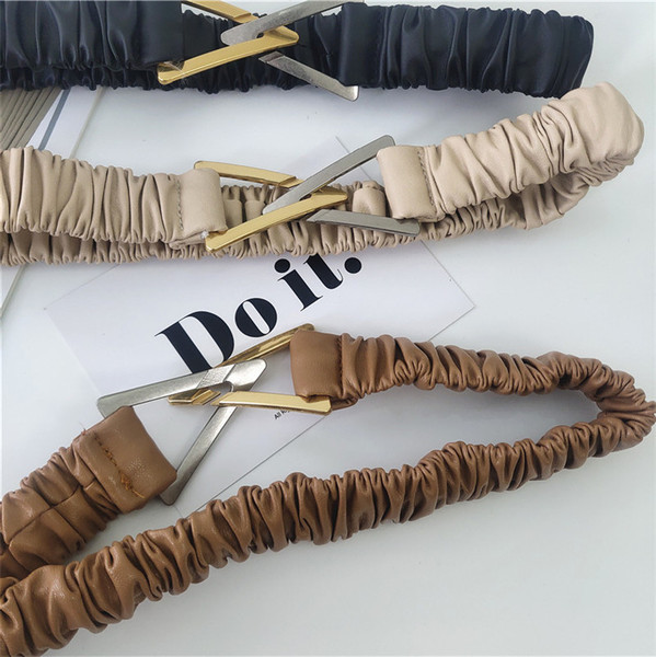 Elasztikus női öv fém háromszöggel