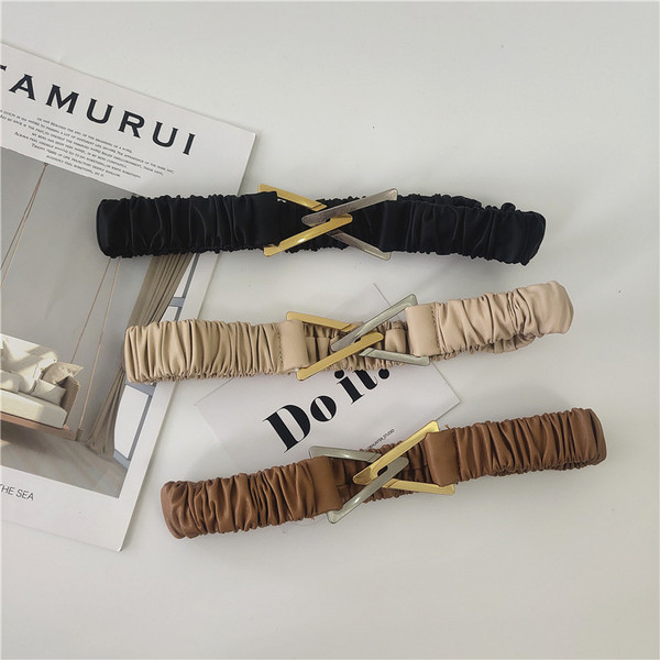 Elasztikus női öv fém háromszöggel