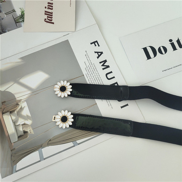 Vékony női elasztikus öv fém elemes virágokkal