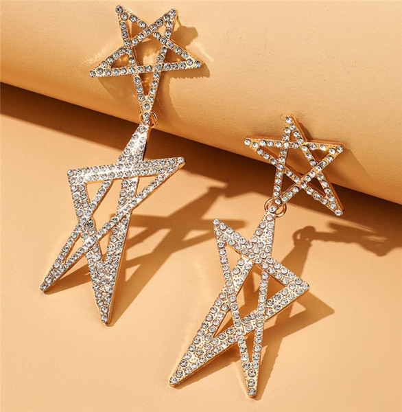 Női lógó fülbevaló arany színű és csillag alakú kövekkel
