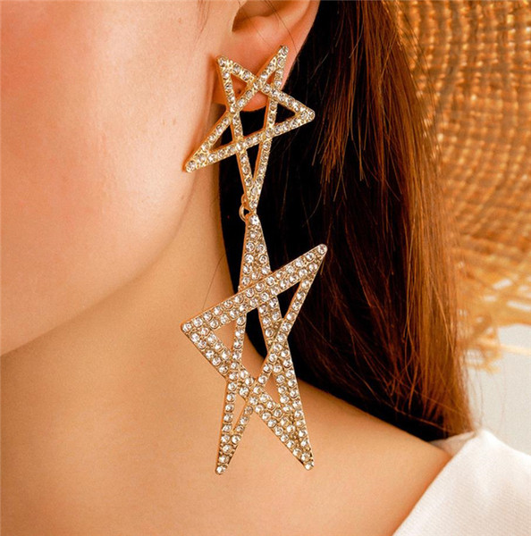 Női lógó fülbevaló arany színű és csillag alakú kövekkel