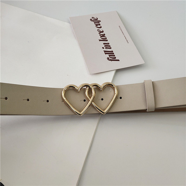 Női bőr öv fém szívecskékkel