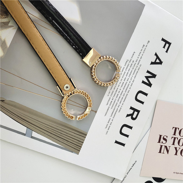 Modern női lakkbőr öv fém gyűrűkkel