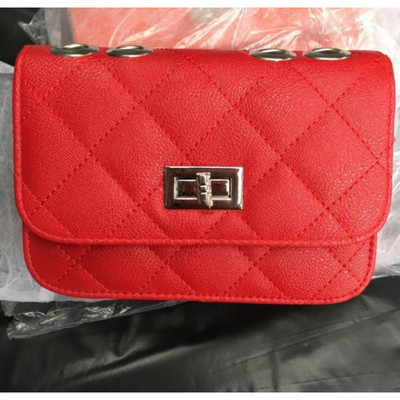 Napi női válltáska és fém csat