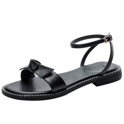 Γυναικεία σανδάλια από οικολογικό δέρμα με κορδέλα και επίπεδη σόλα σε μπεζ χρώμα