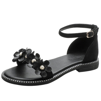 Γυναικεία σανδάλια με τρισδιάστατο στοιχείο και επίπεδη σόλα