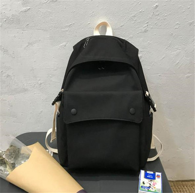 Női textil hátizsák nagy első zsebbel