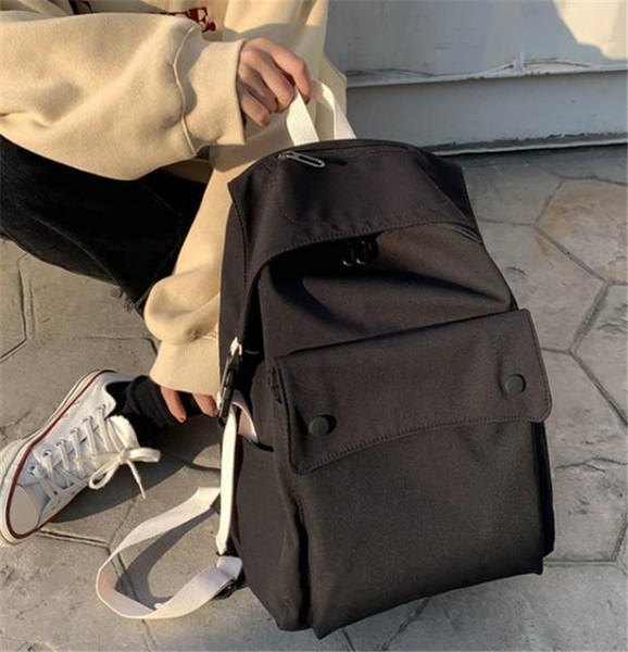 Női textil hátizsák nagy első zsebbel