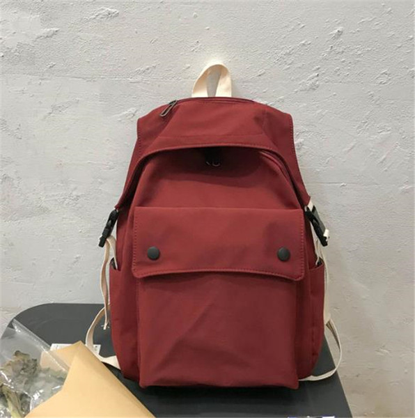 Női textil hátizsák nagy első zsebbel