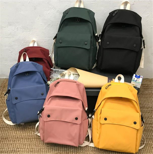 Női textil hátizsák nagy első zsebbel