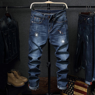 Tavaszi-őszi férfi farmernadrág szakadt motívumokkal