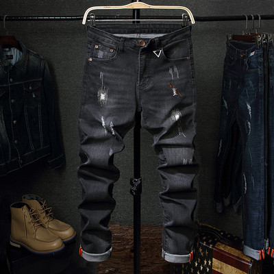 Tavaszi-őszi férfi farmernadrág szakadt motívumokkal