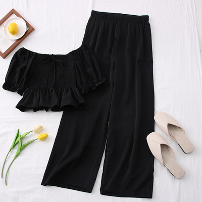 Hétköznapi női szett hosszú nadrágból és rövid blúzból