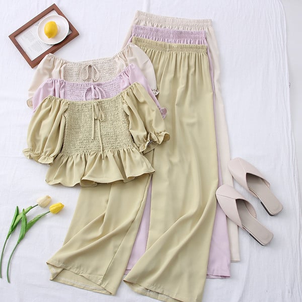 Hétköznapi női szett hosszú nadrágból és rövid blúzból