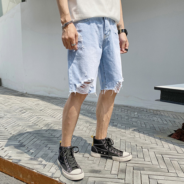 Fájdalmas alkalmi 3/4-es farmer, jobb oldali szakadt kék cipzárral